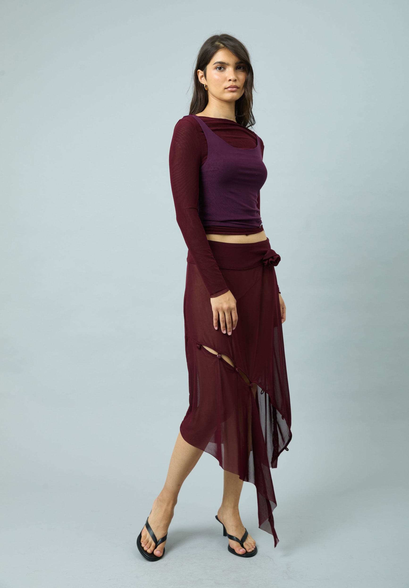 ASYMMETRIC MESH SKIRT WITH FLOWER APPLIQUE