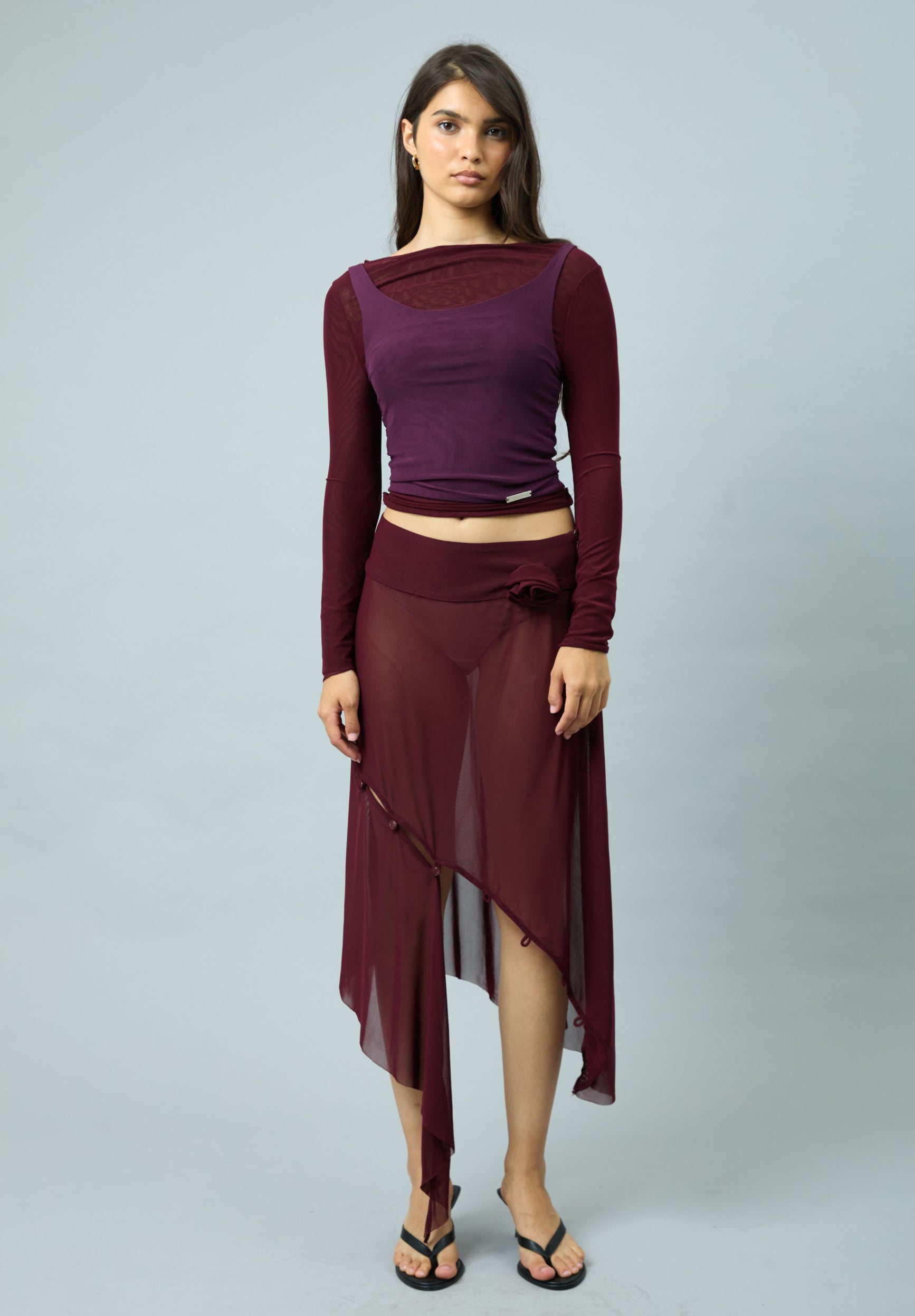 ASYMMETRIC MESH SKIRT WITH FLOWER APPLIQUE