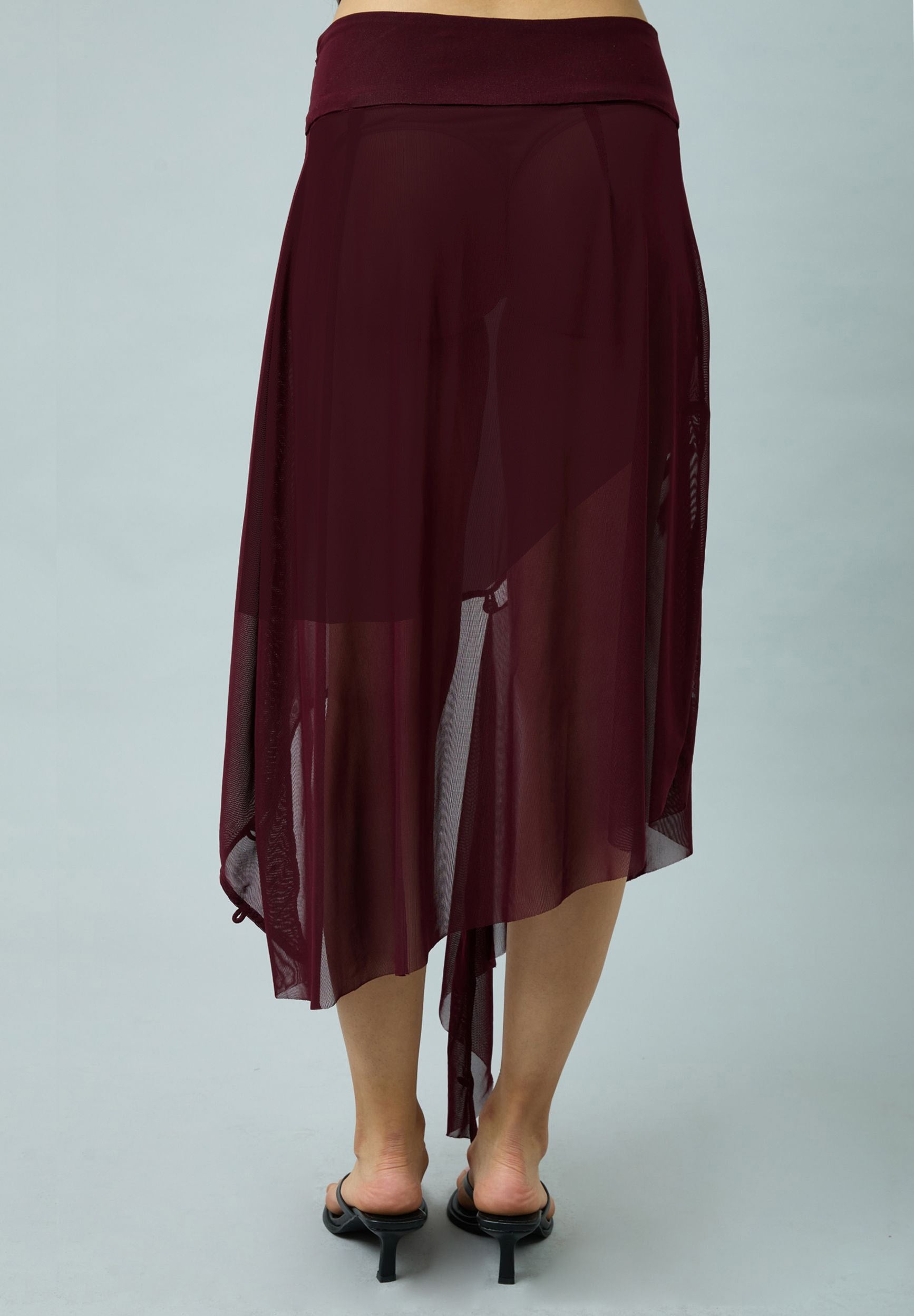 ASYMMETRIC MESH SKIRT WITH FLOWER APPLIQUE